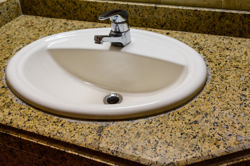 Closeup of sink chrome faucet in a modern shower cabin