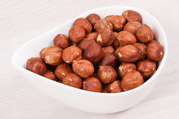 Healthy hazelnuts containing vitamin, minerals and acids, nutritious eating concept