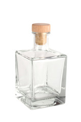 A glass transparent empty bottle with a wooden plug on a white background. Isolated