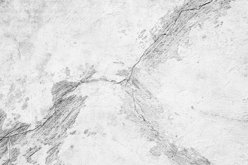 Texture of a concrete wall with cracks and scratches which can be used as a background