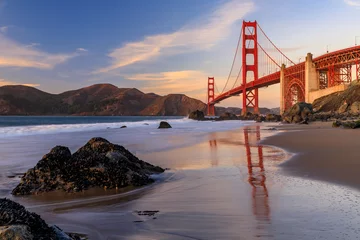 Foto op Plexiglas Golden Gate Bridge Golden Gate Bridge view from the hidden and secluded rocky Marshall's Beach at sunset in San Francisco, California