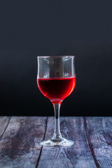 Pink wine. Wine in a glass near fruits and grapes. Traditional Georgian wine according to ancient technology. Copy space Close up and vertical orientation.
