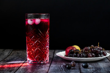 Barberry lemonade, ice drink. Enriched with vitamins. On a dark background