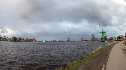 Fototapeta na wymiar Zaanse Schans windmills and town on an overcast day