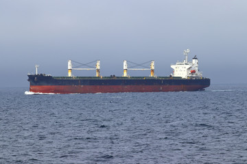 Cargo ship moving in the ocean.