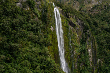 long waterfall in the cliffs of Milford Sound