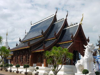 Thai wood temple with cloudy sky - 285385849