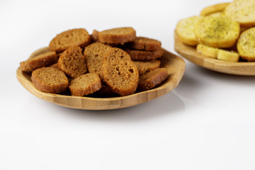 wood plate of crusty bread bruschetta on white background. snack to beer