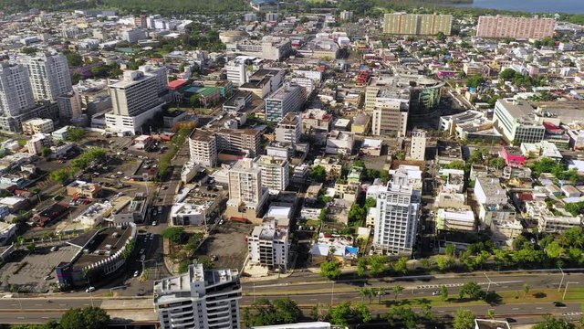 Aerial flyover of the Condado area of Old San, Puerto Rico that shows the main express way and various hotels, office buildings and apartment complexes.