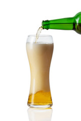 pouring beer into glass on white background