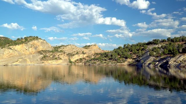 Panning view of Red Fleet Reservoir on sunny morning in Utah.