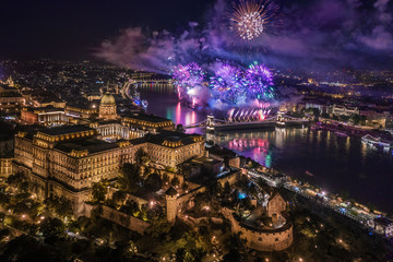 Budapest, Hungary - Aerial panoramic view of the 20th August 2019 state foundation fireworks with illuminated Buda Castle Royal Palace and Szechenyi Chain Bridge by night