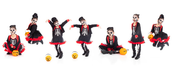 Portrait adorable Asian young girl dress skeleton and witch costume with black hat isolated background