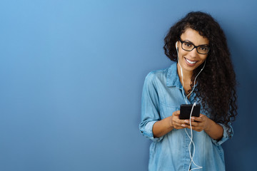 Friendly young woman wearing glasses