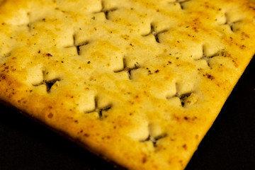 Cracker cookies on dark background.