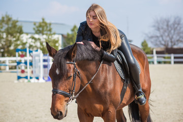 Fototapeta premium Woman with a horses on farm, pets animals in village on a rancho. Horses are human friends