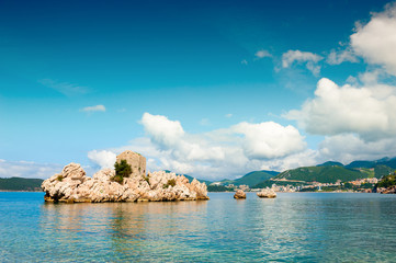 Island with old castle on the beach in Przno near Budva, Montenegro. Adriatic sea. Famous travel destination