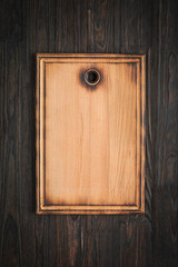 Cutting board on a wooden kitchen table, top view, copy space.