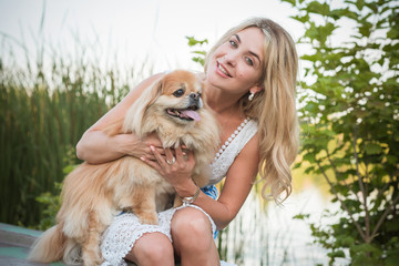 Happy woman with golden dog. Pets psychology 