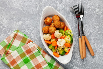 Meatballs with broccoli and a cauliflower