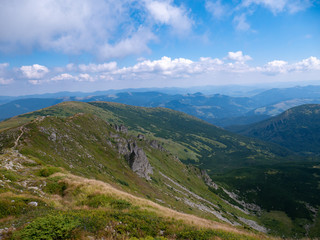 Naklejka premium Mountain valley during sunrise / sunset. Natural summer landscape. Colorful summer landscape in the Carpathian mountains.