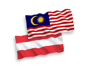 Flags of Austria and Malaysia on a white background