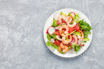 Salad with prawns, grapefruit,  cucumber
