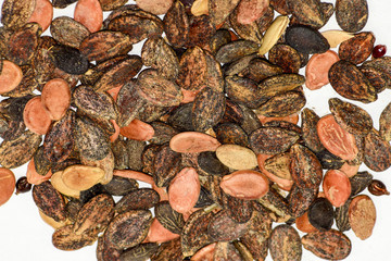 Seeds of watermelon on a white background. watermelon seeds for sowing.