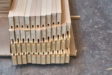 Joinery. Wood door manufacturing process. Stacked door leaf elements. Furniture manufacture.