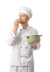 Handsome male chef with soup on white background