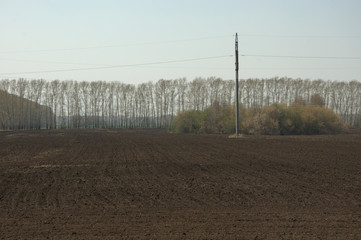 Spring field prepared for sowing, freshly plowed. Landscape.