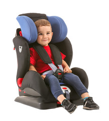 Little boy buckled in car seat on white background