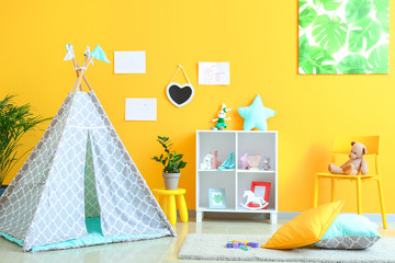 Interior of modern children's room with teepee