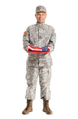 Obraz premium Mature male soldier with USA flag on white background