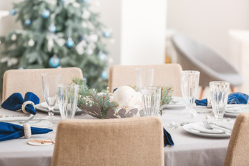Festive table setting for Christmas dinner at home