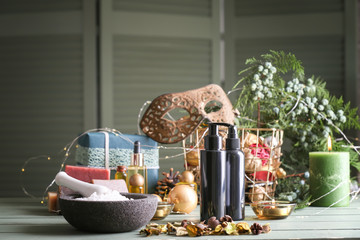 Christmas composition with products for spa treatment on table