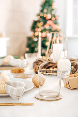 Beautiful table setting with Christmas decorations in living room