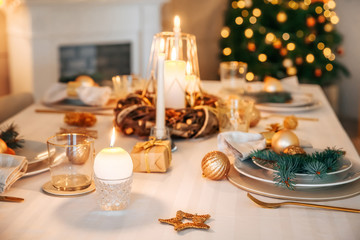 Beautiful table setting with Christmas decorations in living room