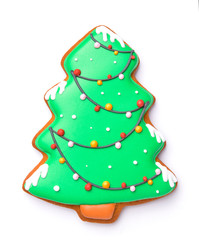 Tasty Christmas cookie in shape of fir tree on white background