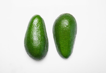 Ripe avocados on white background