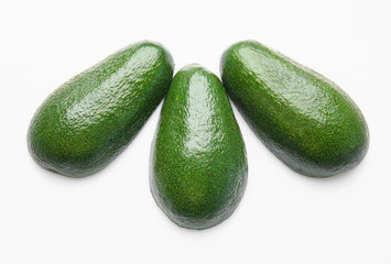 Ripe avocados on white background