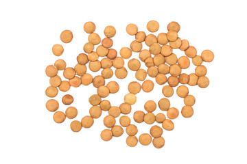 Isolated stack of uncooked lentils on white background from above.