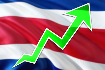 Cote D'Ivoire economy graph is indicating positive growth, green arrow going up with trend line. Business concept on national background.