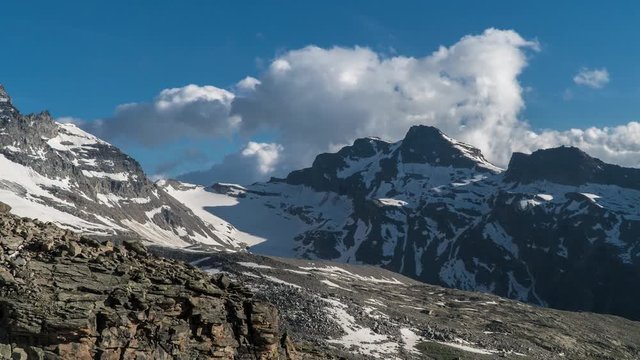 Time lapse of Cloud movement over the European Alps. Gran paradiso national park. Zoom out. 4K