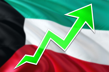Kuwait economy graph is indicating positive growth, green arrow going up with trend line. Business concept on national background.