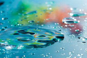 Naklejka na ściany i meble Texture of water droplets in blue. Makro, close-up.