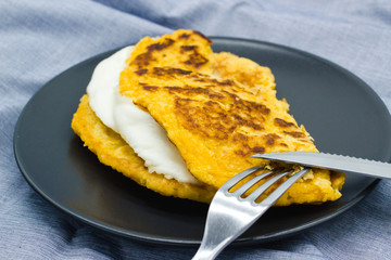 Cachapas, also known as chorreadas, ready to eat. Cachapa is traditional food from Venezuela, Costa Rica and Colombia, corn pancake filled with hand cheese