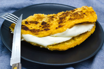 Cachapas ready to eat. Cachapa is traditional food from Venezuela, Costa Rica and Colombia, corn pancake filled with cheese