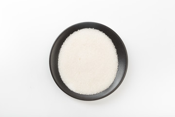 Bowl of sugar isolated on white background, top view - Image