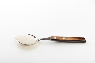 Spoon of fine granulated sugar isolated on white  - Image